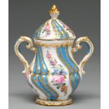 A Sevres style wrythen fluted vase and cover, early 20th c, the spiralling raised gilt and bleu