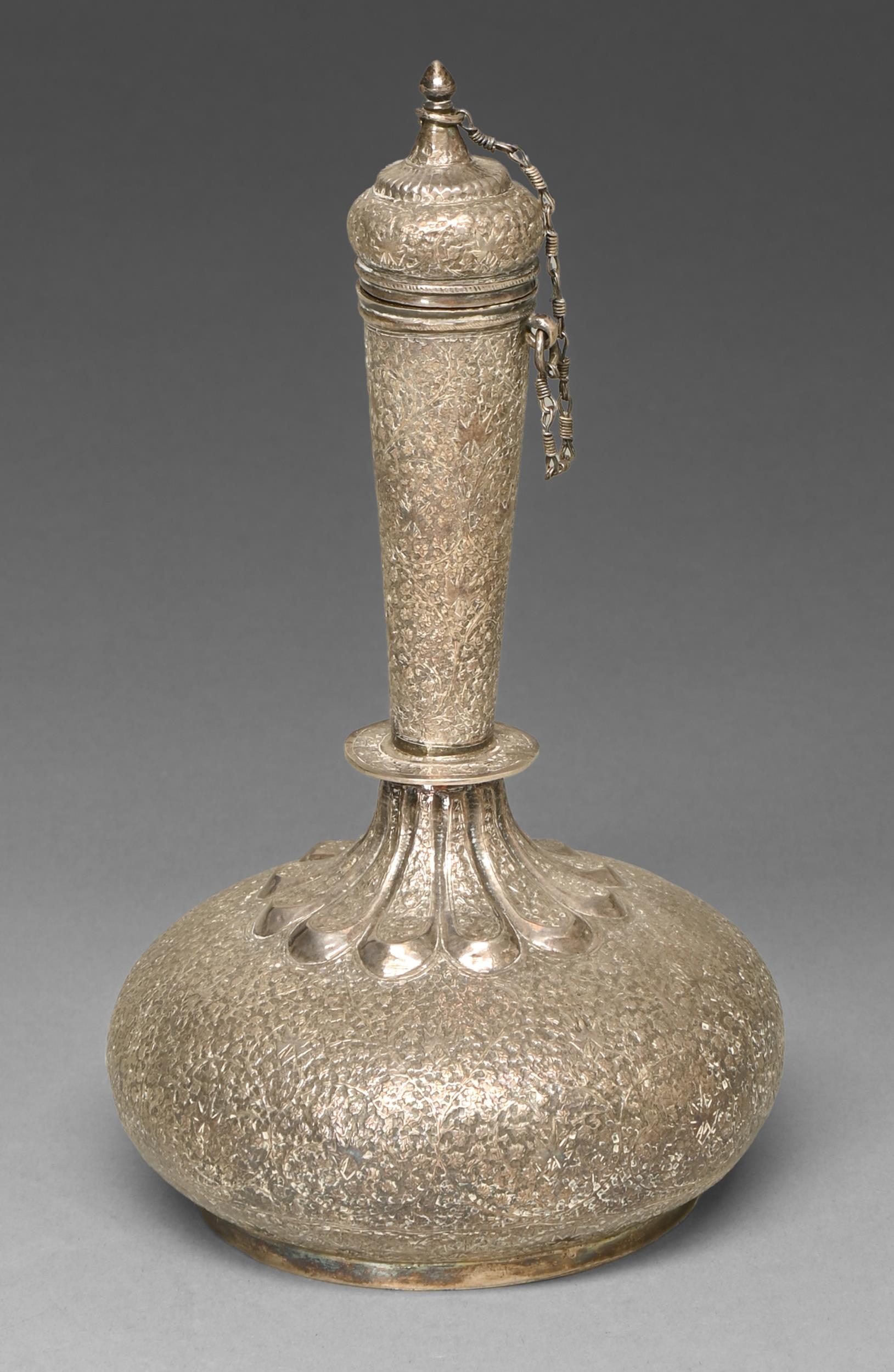 A silver flask and stopper, North India or Kashmir, 19th c, intricately chased with leaves and