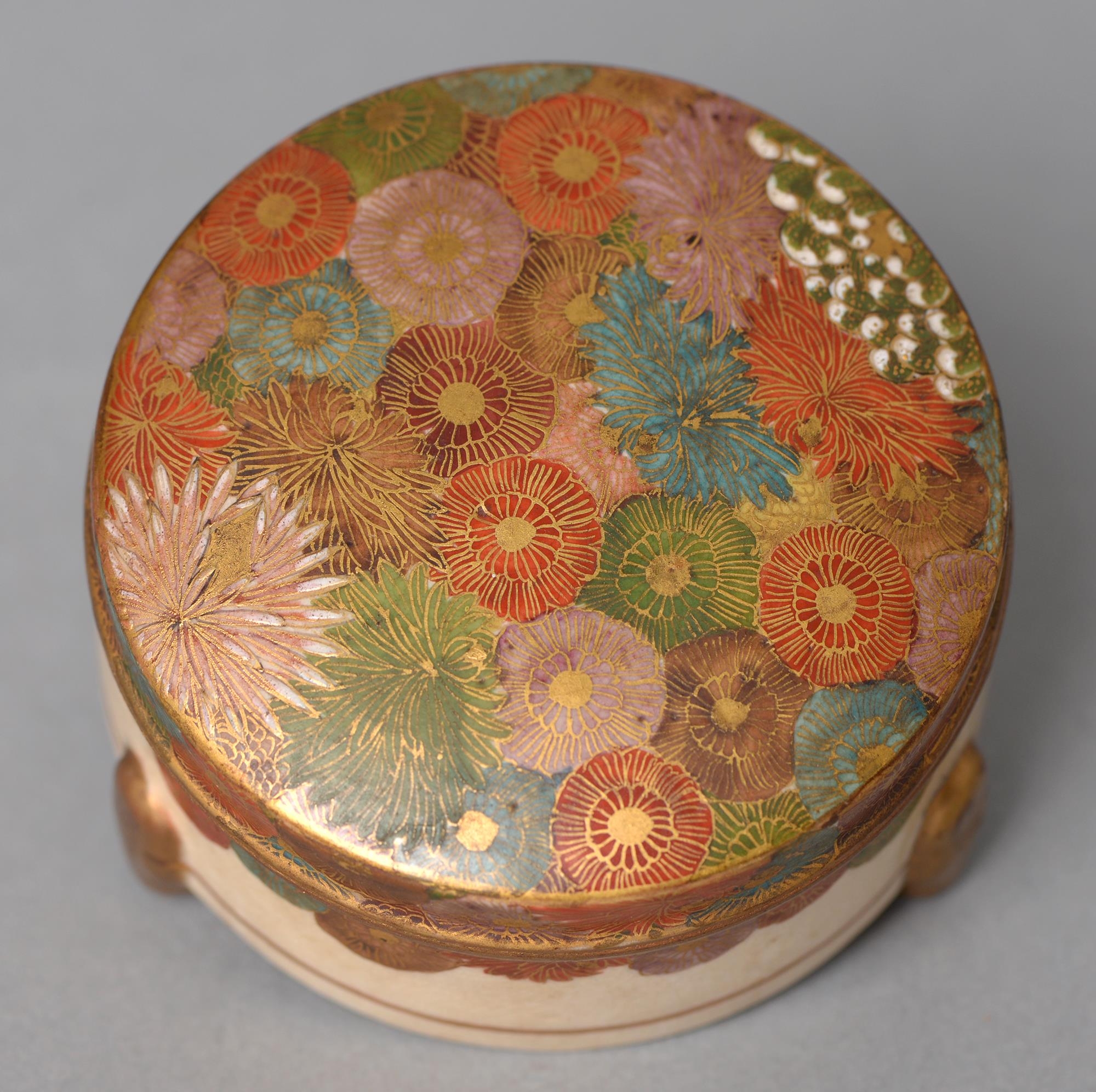 A Japanese box and cover, Kogo, Meiji period, the cover enamelled with densely packed flowers, on