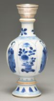 A Chinese moulded blue and white vase, 18th / 19th c, painted with a lady alternating with flowering