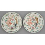 Two Chinese famille rose plates, 19th c and later, painted with a four-clawed dragon and phoenix