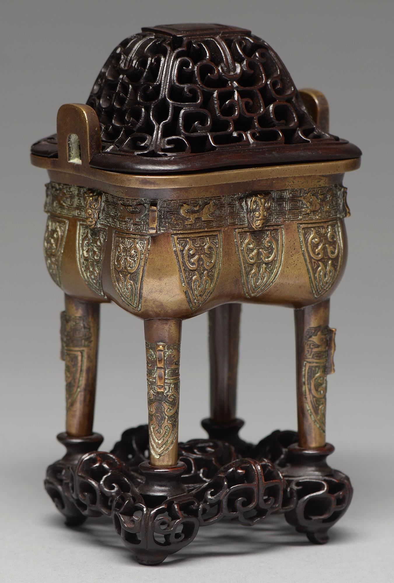A Chinese bronze archaistic vessel, Ding, 20th c, the sides cast with mask and stylised animals on - Image 2 of 3