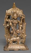 An Indian brass sculpture of Durga slaying the bull demon, 90mm h Wear consistent with some age