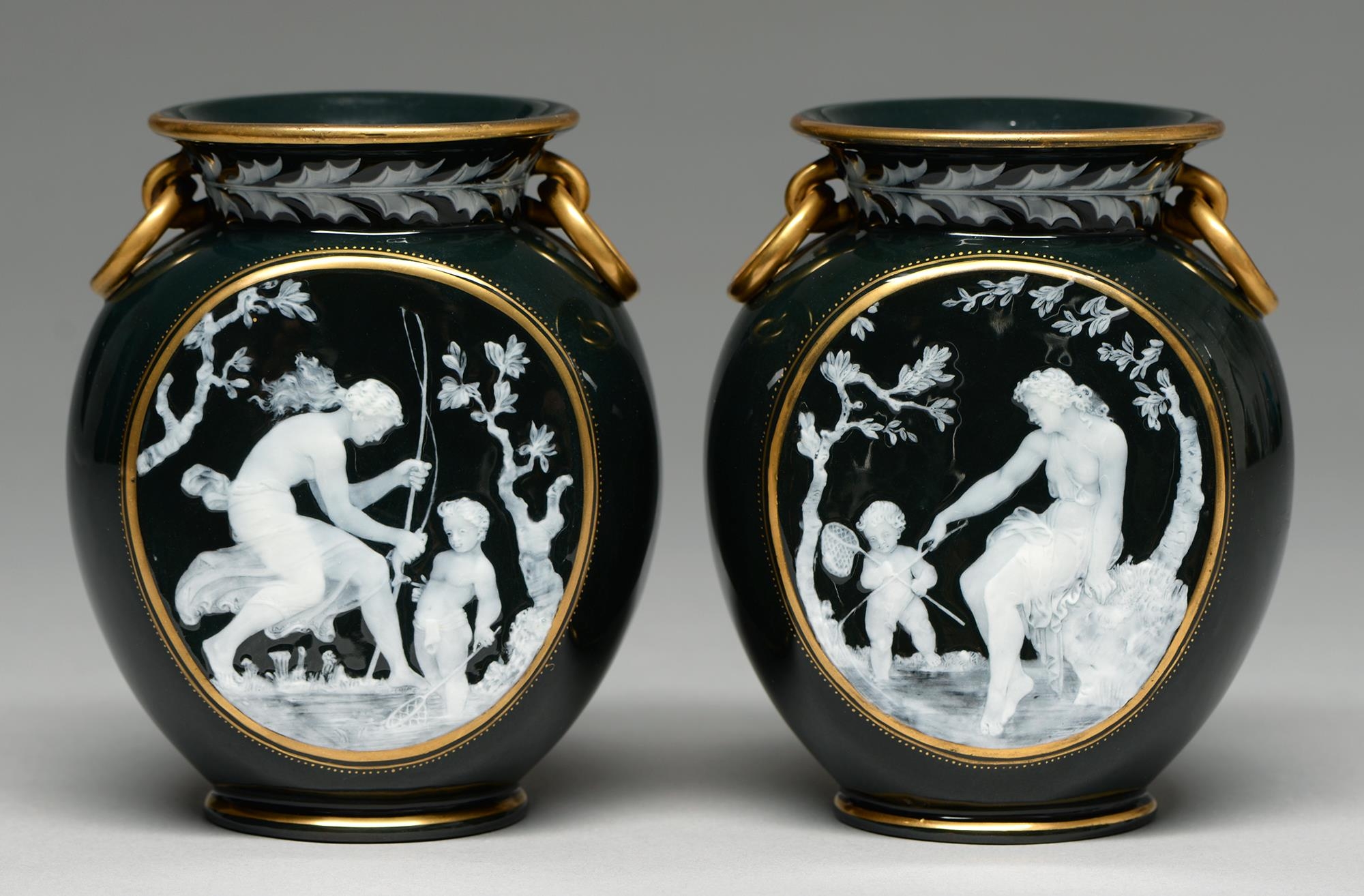 A pair of Brown-Westhead, Moore & Co pate sur pate style vases, c1890, with a nymph instructing