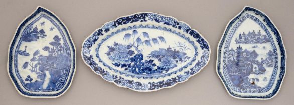 Two Chinese blue and white leaf shaped dishes, 18th / early 19th c, painted with river scenes in