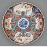 An Imari tray, Meiji period, painted in underglaze blue with a central floral medallion in diaper