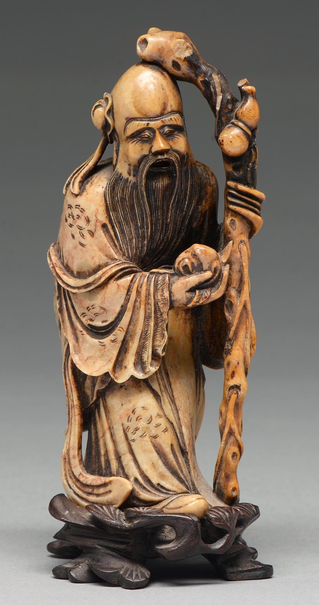 A Chinese soapstone carving of Shouxing, 18th c, 14cm h   Provenance: Collection of Commander