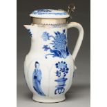 A Chinese moulded blue and white jug, Kangxi period, painted on raised lappets with the figure of