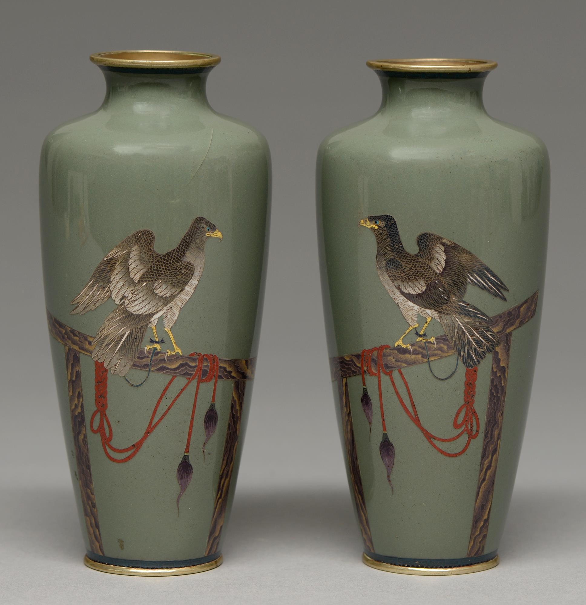 A pair of Japanese cloisonne enamel vases, Taisho period, enamelled in silver wire cloisons with a