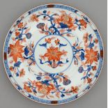 A Chinese Imari dish, 18th c, painted and gilt with lotus and other flowering plants in panelled