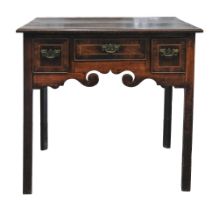 A George III oak and fruitwood lowboy, with crossbanded two plank top and three line inlaid