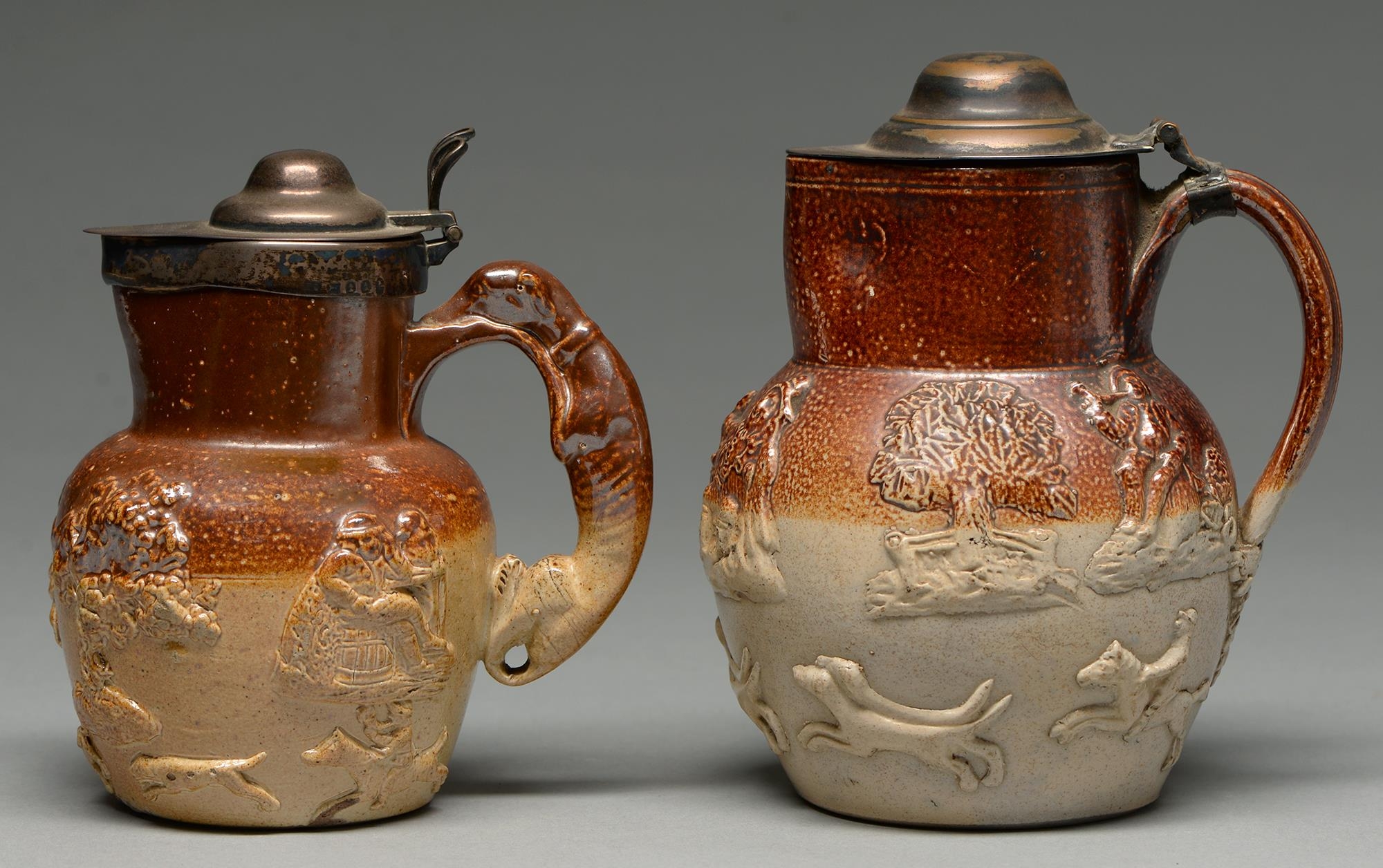 A silver mounted English saltglazed brown stoneware hunting jug, c1797, with greyhound handle, 16.