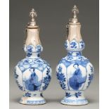 Two Chinese moulded blue and white vases, 18th c, painted with a seated woman alternating with