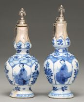 Two Chinese moulded blue and white vases, 18th c, painted with a seated woman alternating with