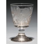 A Victorian glass goblet, c1840, engraved with emblematic foliage, sprig of oak and two birds on