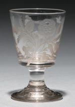 A Victorian glass goblet, c1840, engraved with emblematic foliage, sprig of oak and two birds on