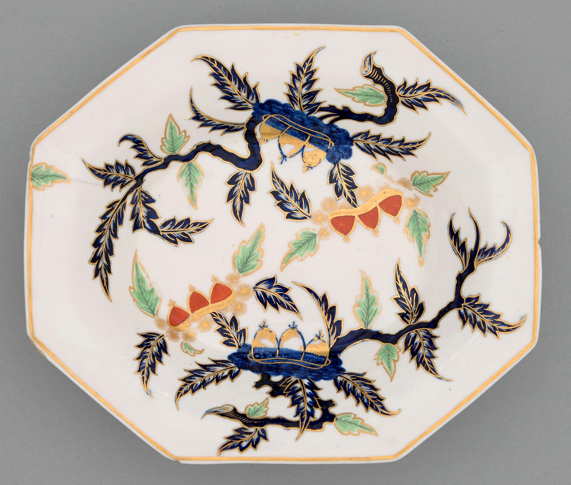 A Derby octagonal dish, c1790, painted in underglaze blue and enamelled and gilt with two