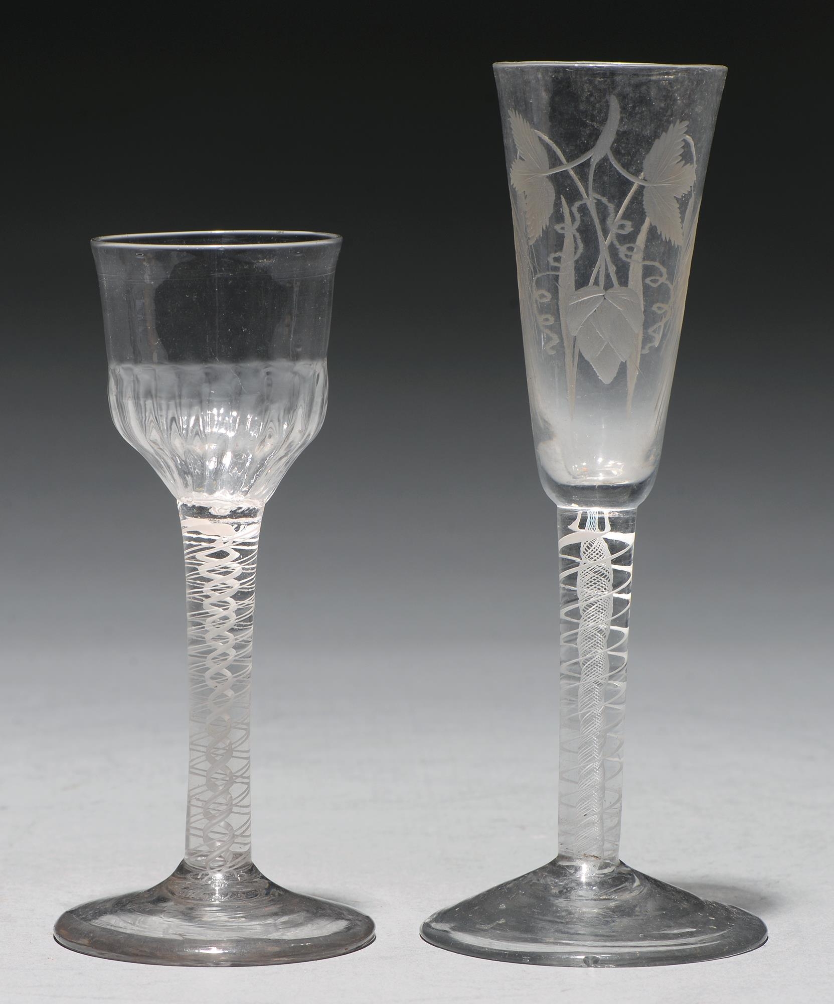 A wine glass, c1770, the fluted ogee bowl on double series opaque twist stem, 14.8cm h and an ale