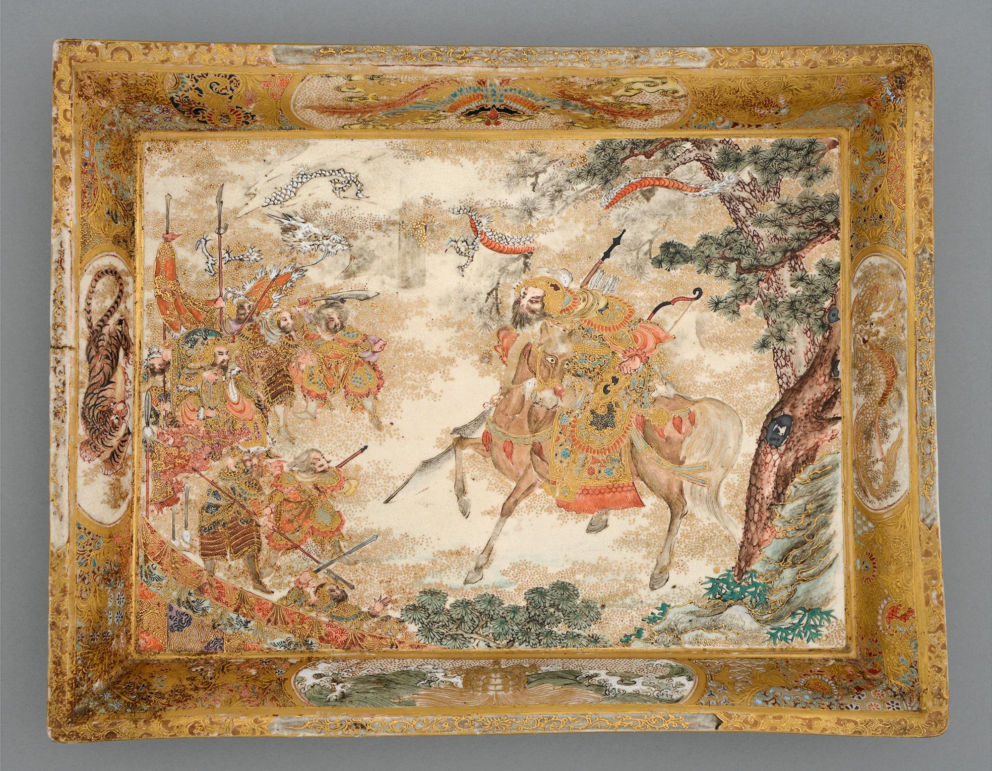 A Satsuma ware tray, Meiji period, decorated with a battle scene with dragon above, the border