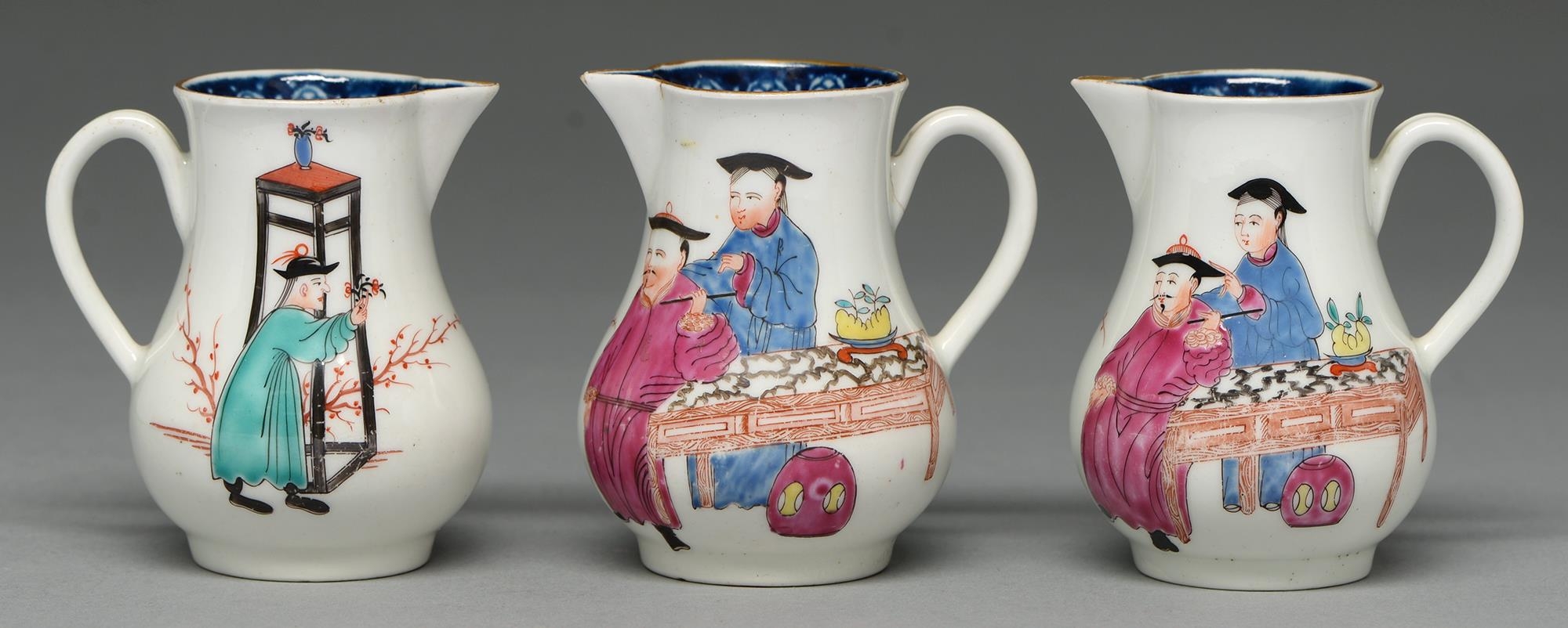 Three Worcester sparrow beak jugs, c1765, with underglaze blue border and painted with thee