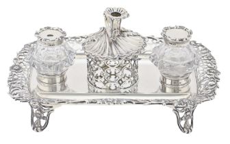 A Victorian silver inkstand, the oblong tray with cast and pierced floral border and conforming