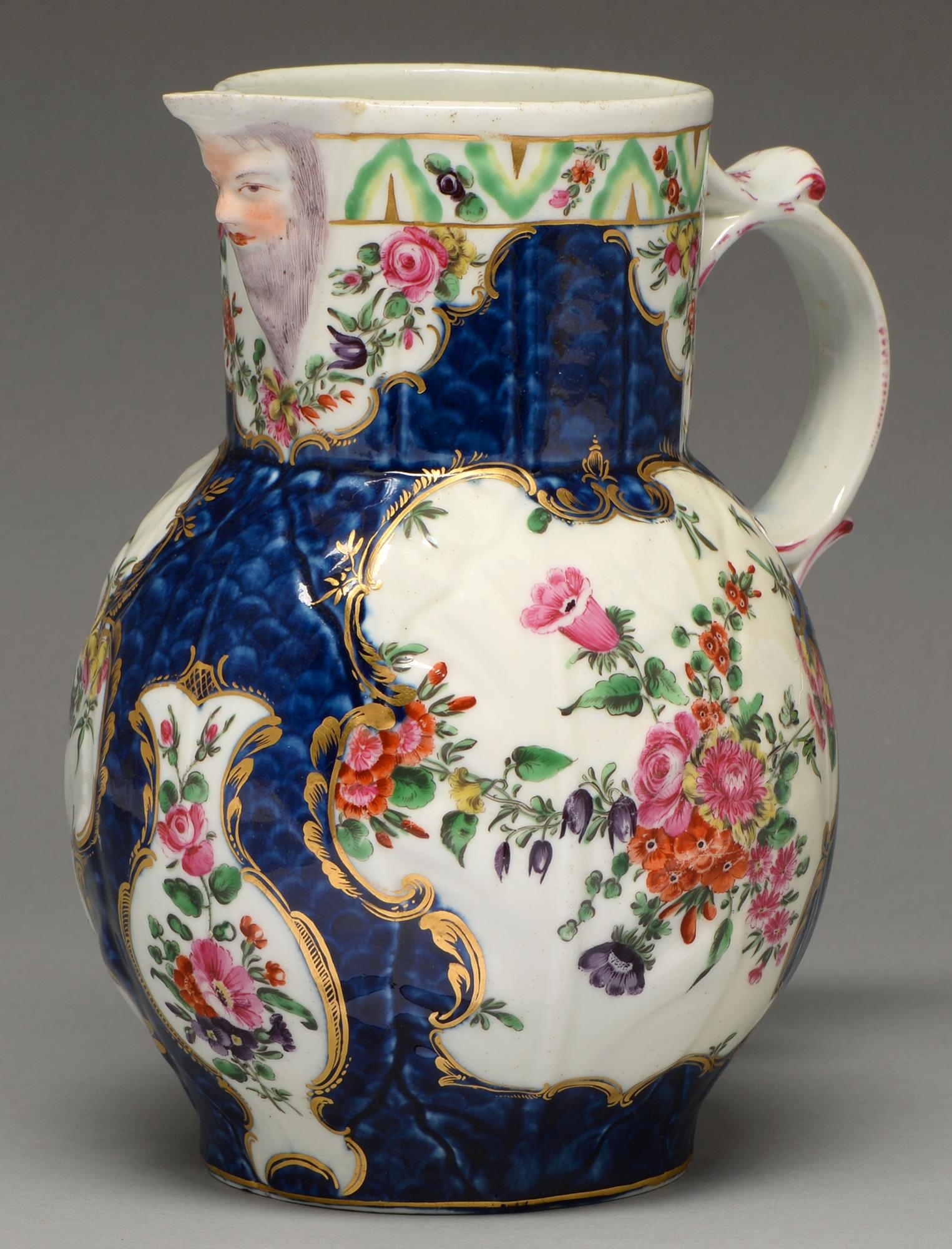 A Worcester scale blue ground cabbage leaf mask jug, c1770, painted in bright enamels with - Image 2 of 3