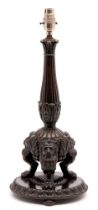A bronze lamp, in Empire style, 19th c, the acanthus clad baluster pillar on three lion monopodia,