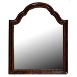 A walnut mirror, late 19th c, in George I style, the shaped and arched moulded frame with giltwood