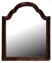 A walnut mirror, late 19th c, in George I style, the shaped and arched moulded frame with giltwood