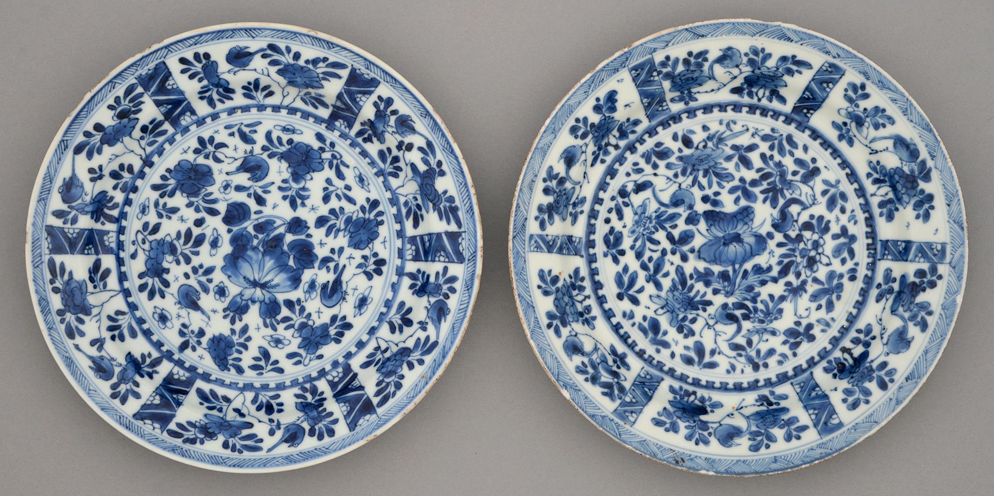 Two Chinese blue and white plates, Kangxi period, painted with flowers and birds in panelled