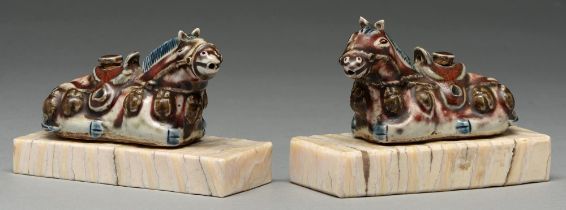 A pair of Chinese blue, white and manganese water droppers and stoppers in the form of horses,