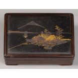 A Japanese wood and mixed metals box and cover, Taisho period, the cover inset with inlaid bronze