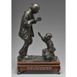 A Japanese bronze sculpture of a man and his small son with Noh mask and drum, Meiji period, even