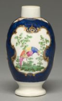 A Worcester scale blue ground tea caddy, c1770, enamelled with brightly plumaged birds and insects