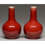 Two Chinese flambe glazed vases, 20th c, the glaze thinning from the neck and pooling slightly