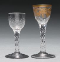 A wine glass, c1780, the ogee bowl gilt with grapevines, on faceted stem, 14.5cm h and a