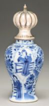 A Chinese moulded blue and white baluster vase, 18th c, painted with a young woman alternating