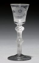 A wine glass, mid 18th c, the flared bowl engraved with Jacobite rose and bud,  on multiple spiral