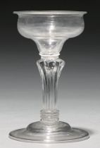 A sweetmeat glass, c1740, the ogee bowl on moulded pedestal stem and domed and folded foot, 16.3cm h