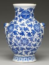 A Chinese blue and white vase, 19th c or later, painted in Ming style with lotus meander, 24.5cm