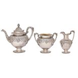 A Scottish Victorian silver tea service, of vase shape and embossed with grapevines in egg-and-
