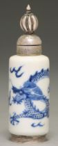 A Chinese blue and white miniature vase, 18th c, painted with a dragon, later adapted for snuff with