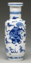 A Chinese blue and white rouleau vase, late 19th c, painted with dogs of Fo and bats beneath