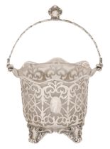 A Victorian silver openwork sugar basket, the annular bowl pierced with tracery, oval paterae and