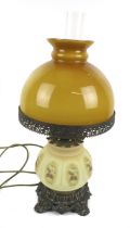 A vintage table lamp converted from an oil lamp.