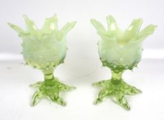TO BE COLLECTED. A pair of vaseline green glass vases.