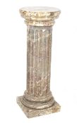 A large marble doric column display/plant stand.