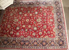 A large Persian style wool rug.