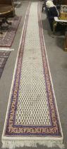A large Indian Kaimuri woollen hall runner carpet rug.