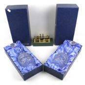 A pair of Waterford Crystal glass decanters and a brass inkstand.